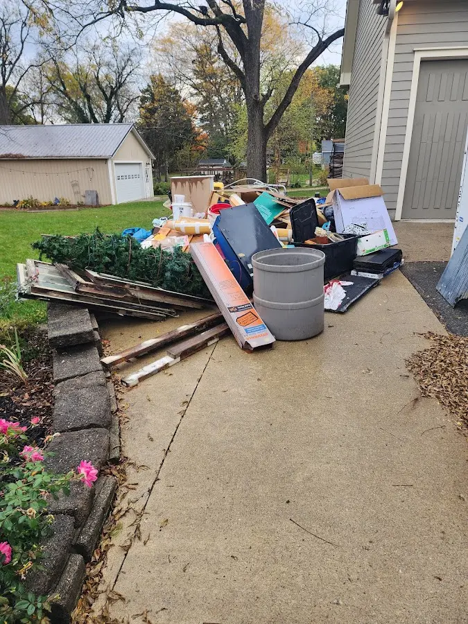 Dumpster being loaded with debris for Commercial Dumpster Rental in Loxley